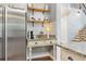 Kitchen coffee bar area with stainless steel appliances, granite countertop, and subway tile at 2898 Stockbridge Way, Dacula, GA 30019