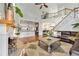 Bright living room with hardwood floors, a stone fireplace, and an open concept to the kitchen at 2898 Stockbridge Way, Dacula, GA 30019