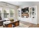 Bright living room features custom built-ins and decor at 2898 Stockbridge Way, Dacula, GA 30019