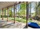 Backyard featuring a large covered patio with views of the private, wooded lot at 2898 Stockbridge Way, Dacula, GA 30019