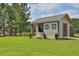 Backyard with shed, TV, and green grass at 15 Granville Ln, Covington, GA 30016