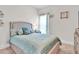Relaxing bedroom with a plush bed, soft blue accents, and comfortable furniture, offering a serene retreat at 15 Granville Ln, Covington, GA 30016