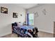 Sports-themed bedroom with a twin bed, sporty decor, and a window for natural light at 15 Granville Ln, Covington, GA 30016