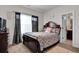 Comfortable bedroom featuring a queen bed, stylish bedding, and an attached bathroom for convenience at 15 Granville Ln, Covington, GA 30016