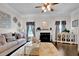Inviting living room with a fireplace, plush rug, stylish furniture, and elegant decor at 15 Granville Ln, Covington, GA 30016