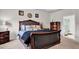 Elegant bedroom with a king-sized bed, stylish furniture, and an en-suite bathroom at 15 Granville Ln, Covington, GA 30016