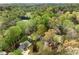 Aerial view showcasing landscaped property with mature trees and a pool in distance at 259 Dartmoor Cir, Atlanta, GA 30328