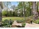 Landscaped backyard with garden shed, mature trees and a birdhouse at 259 Dartmoor Cir, Atlanta, GA 30328