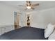 Cozy bedroom with mirrored closet doors and a ceiling fan at 259 Dartmoor Cir, Atlanta, GA 30328
