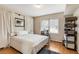 Bright bedroom with hardwood floors, white linens, and ample natural light at 259 Dartmoor Cir, Atlanta, GA 30328