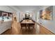 Contemporary dining space with wood floors, modern art, and a seamless connection to the living area at 259 Dartmoor Cir, Atlanta, GA 30328