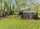 Exterior view of home featuring a large lawn and mature trees at 259 Dartmoor Cir, Atlanta, GA 30328