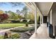 Beautiful front yard with a fountain and landscaping, viewed from the home's covered porch at 259 Dartmoor Cir, Atlanta, GA 30328