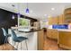 Kitchen island with seating and pendant lighting, open to the living area at 259 Dartmoor Cir, Atlanta, GA 30328