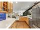 Modern kitchen with stainless steel appliances and ample cabinetry with an open layout to the living room at 259 Dartmoor Cir, Atlanta, GA 30328