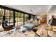 Sun-filled living area with floor-to-ceiling windows, stylish seating, and an open-concept layout at 259 Dartmoor Cir, Atlanta, GA 30328