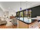 Open-concept living area featuring hardwood floors and large windows overlooking the yard at 259 Dartmoor Cir, Atlanta, GA 30328