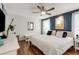 Comfortable main bedroom featuring hardwood floors, neutral paint, and plenty of natural light at 259 Dartmoor Cir, Atlanta, GA 30328