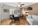 Well-lit home office space with a desk, seating area, and stylish decor at 259 Dartmoor Cir, Atlanta, GA 30328