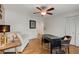 Home office with hardwood floors, ceiling fan, desk, and a comfortable seating area at 259 Dartmoor Cir, Atlanta, GA 30328