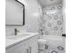 Modern bathroom with white marble-patterned tiles and sleek fixtures, featuring a shower-tub combo at 515 Federal Se Ter, Atlanta, GA 30315