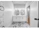 Modern bathroom featuring white double vanity and patterned floor tile at 515 Federal Se Ter, Atlanta, GA 30315