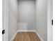 Walk-in closet with wood-look flooring and white trim, offering a functional and organized storage space at 515 Federal Se Ter, Atlanta, GA 30315