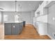 Modern kitchen with gray island and white cabinets, complete with stainless steel appliances at 515 Federal Se Ter, Atlanta, GA 30315