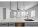 Spacious living room with kitchen island sink, ceiling fan, and natural light at 515 Federal Se Ter, Atlanta, GA 30315