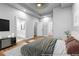 Comfortable main bedroom showing hardwood floors and an ensuite bathroom with a double vanity at 515 Federal Se Ter, Atlanta, GA 30315