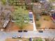 An aerial view of a charming home in a mature neighborhood with a long driveway and beautiful trees at 770 Waters Sw Dr, Atlanta, GA 30310