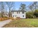 Backyard view of the home with wooden deck and grassy lawn at 770 Waters Sw Dr, Atlanta, GA 30310