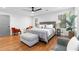 Large modern bedroom with hardwood floors, multiple windows and an ottoman at 770 Waters Sw Dr, Atlanta, GA 30310