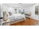 Cozy bedroom featuring hardwood floors, a comfortable bed, and a television at 770 Waters Sw Dr, Atlanta, GA 30310