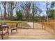 Wooden deck with outdoor furniture overlooks the backyard at 770 Waters Sw Dr, Atlanta, GA 30310