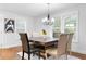 Elegant dining room features a stylish table, modern lighting, and ample natural light at 770 Waters Sw Dr, Atlanta, GA 30310