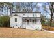 Charming two-story home features a white exterior, inviting front porch, and well-maintained landscaping at 770 Waters Sw Dr, Atlanta, GA 30310