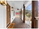 Inviting front porch features wooden deck, ceiling fan, and stylish outdoor lighting at 770 Waters Sw Dr, Atlanta, GA 30310