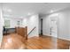 Hardwood hallway landing leading to a bathroom and office area at 770 Waters Sw Dr, Atlanta, GA 30310