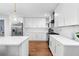 Modern kitchen features white cabinets, quartz countertops, and stainless steel appliances at 770 Waters Sw Dr, Atlanta, GA 30310