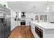 Bright kitchen features stainless steel appliances, island, and white cabinets at 770 Waters Sw Dr, Atlanta, GA 30310