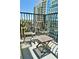 Balcony space with wooded seating and views of the surrounding high rise buildings at 195 14Th Ne St # 1507, Atlanta, GA 30309