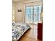 Bright bedroom featuring hardwood floors and balcony access with sliding glass doors at 195 14Th Ne St # 1507, Atlanta, GA 30309