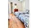 Cozy bedroom featuring hardwood floors, closet space, and twin beds with patterned bedding at 195 14Th Ne St # 1507, Atlanta, GA 30309