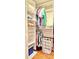 Walk in closet with wire shelving, wood floors, and clothing racks for ample storage space at 195 14Th Ne St # 1507, Atlanta, GA 30309