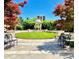 Landscaped courtyard featuring mature trees, garden gazebo, manicured lawn, and inviting seating areas at 195 14Th Ne St # 1507, Atlanta, GA 30309