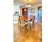Cozy dining room features a chandelier, hardwood floors, built-in shelving and seating for four at 195 14Th Ne St # 1507, Atlanta, GA 30309
