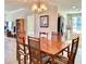 Bright dining area with chandelier and views into the kitchen at 195 14Th Ne St # 1507, Atlanta, GA 30309