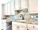 Kitchen featuring granite countertops, stainless steel appliances, and custom cabinetry at 195 14Th Ne St # 1507, Atlanta, GA 30309