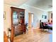 Cozy living room featuring hardwood floors, a decorative cabinet, and comfortable seating at 195 14Th Ne St # 1507, Atlanta, GA 30309